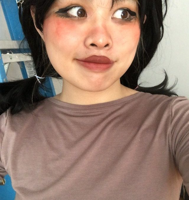 I have a black wig and I look unnatural in it.  How to change makeup to compensate?