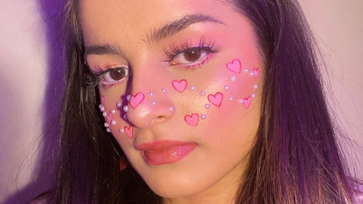 “Hearts on my face because wearing it on your sleeve is so outdated.”  – Valentine’s Day makeup by me!